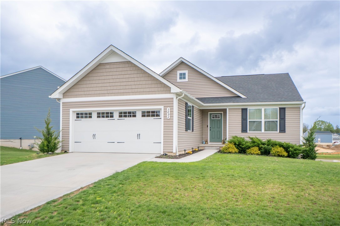 Welcome to this beautiful Ryan Homes Tupelo floorplan in Brookside Greens, built in 2023 and offering easy one-floor living with modern finishes throughout! Step inside through the welcoming foyer entryway with convenient closets, where upgraded LVP flooring flows through the main living spaces. Just off the foyer are two comfortable bedrooms and a full bath with a tub/shower combination, creating a functional layout for guests and family, or a home office! The heart of the home opens into a bright and spacious living room and eat-in kitchen, featuring a pantry, large kitchen island with breakfast bar seating, quartz countertops, stainless steel appliances, and a gas stove. Sliding doors lead to a private Trex deck overlooking the backyard and peaceful pond view, perfect for relaxing or entertaining. The primary suite offers a walk-in closet and private bath with dual sink vanity and standing shower. A first-floor laundry room adds everyday convenience, while the unfinished walkout lower level provides excellent storage and future finishing potential. Enjoy an attached 2-car garage, front porch, and a great community setting with Brookside Greens clubhouse, pool, and playground all within walking distance!