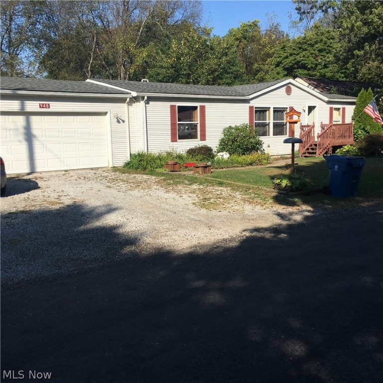 PRICE REDUCED! Well maintained three bedroom, two bath MODULAR ranch home on two 50x130 parcels. Springfield local school district. Seller offering home warranty.

Enter through the front door into a spacious living room that opens into a beautiful kitchen and dining area with snack bar between. Master bedroom, off the living room, has private master bath with ample storage. Hall from dining room leads to two bedrooms at each end and full bath situated in the middle. Stair between living/dining room area leads to full basement that has unfinished drywall installed and includes a pool table. Laundry/utility area off kitchen has door that leads into attached 23x24 two car garage with drain, openers, and a side man door. Dining room has UV resistant glass sliding door that opens onto two rear decks, 16x16 upper and 17x25 lower. Back yard has garden area(s), firepit, and a nice shed with loft storage. New furnace in 2012, kitchen and dining room floor in 2012, central air in 2015 , maste