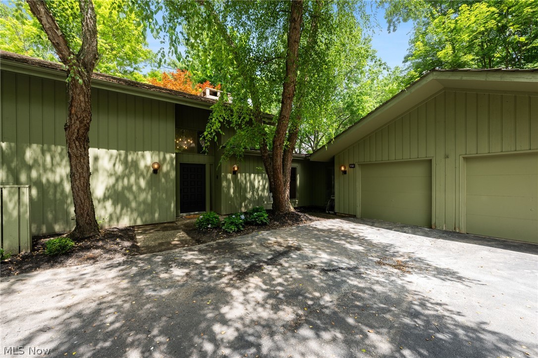 Beautifully updated contemporary condo in desirable Russet Woods in Walden, offering 3 bedrooms, 2.5 baths, 2 car garage and over 3,000 sq ft of living space. One of the only units that stands alone.
 Features include soaring ceilings, a dramatic floor-to-ceiling fireplace, walls of windows, fresh paint, new carpet, and updated flooring throughout. Entertain with ease with the dry bar or relax in the updated sunroom equipped with bar and custom epoxy flooring.

Enjoy the private wooded outdoor setting complete with hot tub hookup. Recent updates include two renovated bathrooms, fireplace, sunroom, electrical panel, and numerous additional improvements throughout. A rare opportunity to own a move-in ready contemporary retreat in Aurora.