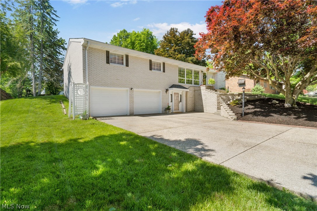 Charming white brick ranch with open concept floor plan and generous natural lighting, located in Jackson Township. This 3-bedroom and 3-full bathroom home provides for a fun and comfortable living space. Master bedroom has full-bath and large sliding closet doors for your entire wardrobe. Snuggle up next to the cozy fireplace when the weather gets cold and stay cool in the 4-season room during the warmer months. Enjoy grilling out as well as hosting friends and family all summer on the spacious deck that walks out into the backyard with storage shed. The basement offers a year-round space for entertaining with bar and large recreation area. Basement has laundry room, full bathroom, and leads to attached 2-stall garage with loads of storage space and built-in workbench.