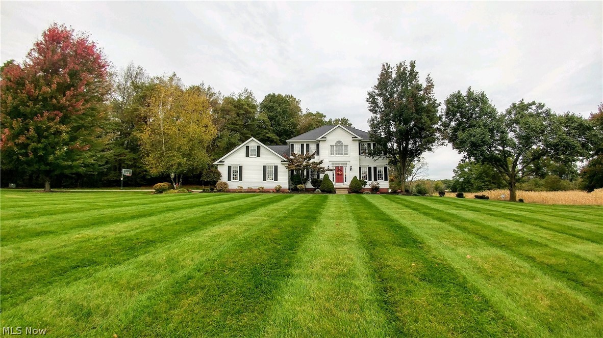 Welcome home, to this gorgeous 3200 sq. ft estate home situated on 5 ACRES in LAKE TOWNSHIP. Privacy is assured as this home sits on a Cal de Sac and is accessed by a 710 ft long driveway, leading to a 2 car side-entry garage, & a concrete pad for ample parking. This home features a finished walkout lower-level which could be a rental opportunity or an in-law suite. It comes w/ an eat-in kitchen, full bathroom, bedroom, family room w/ gas fireplace, pool table (negotiable) & a laundry room. French doors lead to a walk-out patio. Back on the main floor you will greet your guests at the 2-story foyer w/ hardwood flooring. Double pocket doors in the living room open up to the family room. The large family room has a true masonry wood burning fireplace complete with gas logs. Features an open concept kitchen w/ a large island, pantry. The large dinette w/ sliding doors to the huge secluded deck that allows for outdoor entertaining w/ views of the woods.The formal dining room is off the kit