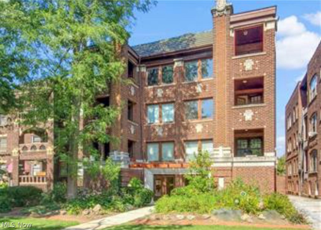 This beautiful 3 bedroom, 2 full bath condo awaits. It offers a timeless exterior, updated interior, with a flowing floor plan. Amenities includes covered parking, in suite washer and dryer, extra storage locker, and french doors leading to a private covered balcony. Over 2000 square feet including expansive great room and dining room with huge stained glass windows and gorgeous hardwood floors throughout. Just around the corner to Coventry's shopping, restaurants, and minutes away from University Circle, Universities, Little Italy, and Hospitals.