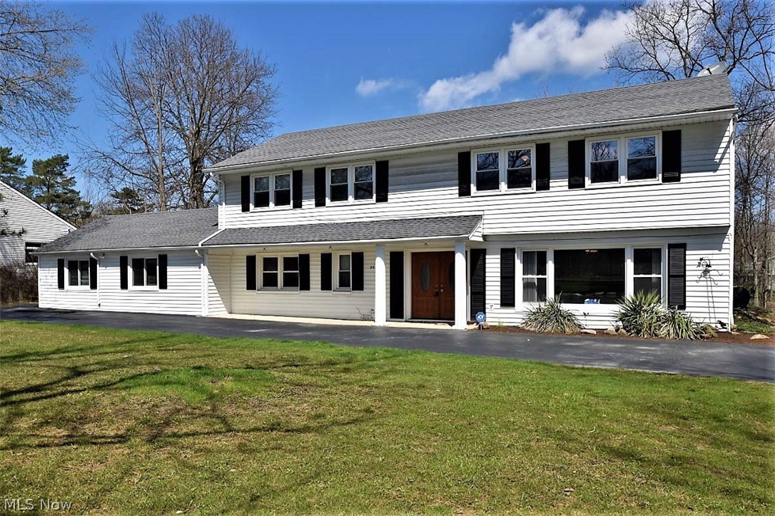 Large and beautifully updated home on Shaker West across from the park and walking trails with a very deep lot and 3 car garage!  Set back from the street on an almost 1 acre lot, this home welcomes guests into a spacious foyer. The huge living rm w/ picture window and hrdwd floors is perfect for quiet conversation or for home office.  Two steps up is the vaulted family rm w/sliding doors to the recently refinished deck and scenic back yrd.  The DR is at one end of the FR, leaving plenty of space to expand a table for gatherings.  The kit was remodeled in 2014 and includes quartz counters, an amazing pantry, dbl oven, elec. cooktop, dishwasher and stainless frig. The 1st fl laundry/mud rm leads to the garage.  Completing the 1st flr is a nanny/inl-law/guest suite with a full bath attached.  Upstairs, the mstr suite has his & her walk in closets behind a mirrored wall, & a totally remodeled bath (2016), featuring heated tile floor & step down tiled shower, dbl vanities & all new fixture