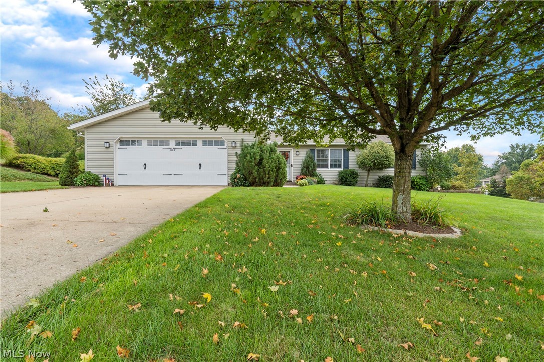 If you’ve been searching for the perfect family home, this is it. Seriously…this is THE one! Let’s start outside. Can we talk about curb appeal? Built in 1995, this home has the classic “new construction” look, including a brand-new garage door with opener installed in 2020 and roof in 2013. Situated on a corner lot, this 3-bed/3-bath ranch home has over ½ acre of beautiful, low-maintenance landscaping encasing the home and yard, which is great, because let’s be honest, you don’t have time to garden. Inside is just as impressive and LITERALLY has it all! Open concept living areas are perfect for entertaining with neutral tones throughout. The kitchen features quartz countertops,  newer appliances and even a kitchen island with additional seating. A split-bedroom layout offers 2 bedrooms just off the living room and an owner’s suite off the kitchen. First floor laundry/mudroom just inside the garage make this one-story living at its best. The finished lower-level features a rec room plu