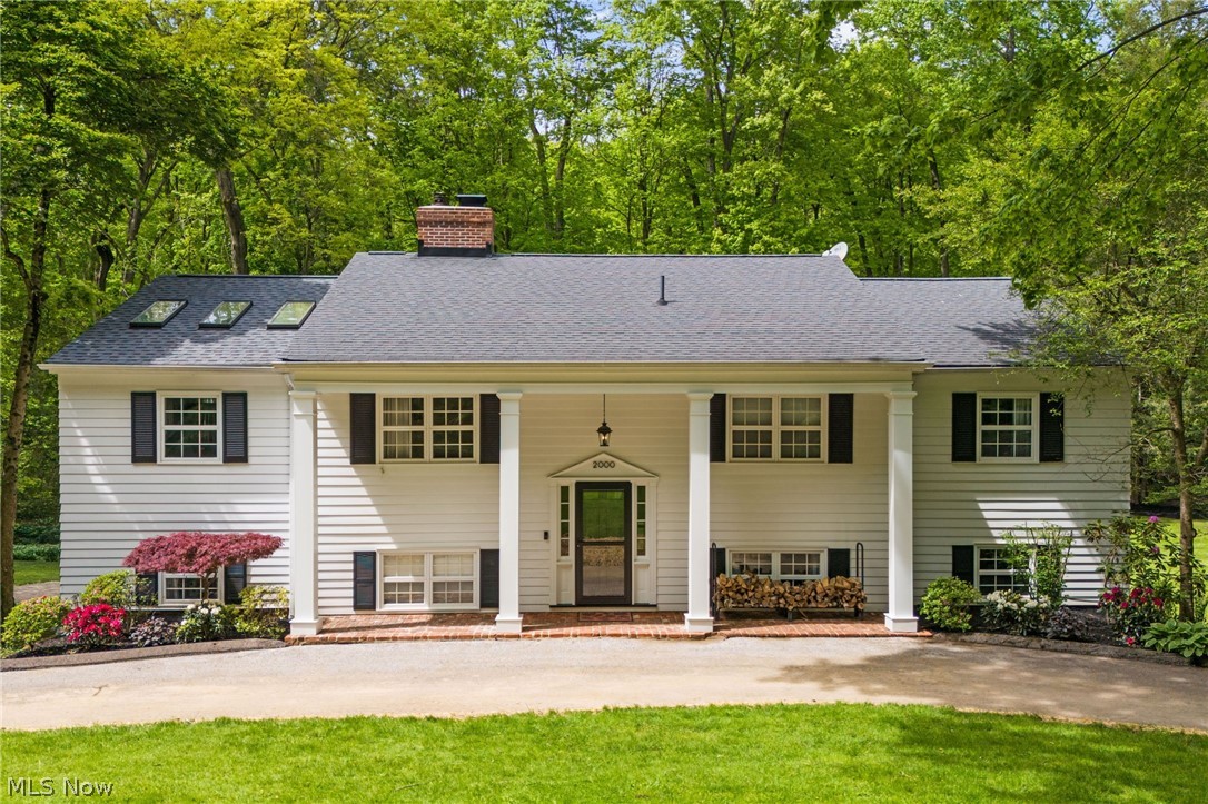 Tucked away on an extraordinary parcel in the heart of Gates Mills, this stunning estate at 2000 Berkshire Rd offers the perfect blend of natural privacy, open green space, timeless character, and sophisticated modern living. Surrounded by mature trees and picturesque scenery, the setting feels peaceful and secluded while still offering an inviting openness that makes the property truly unforgettable. Inside, chic contemporary updates have been thoughtfully designed to preserve the home’s original charm and architectural character. Sunlight pours through expansive windows, filling every room with warmth and natural light. With 5 spacious bedrooms and 5 beautifully updated bathrooms, this home offers exceptional comfort, flexibility, and style throughout. The luxurious primary suite is a true retreat, featuring generous proportions, serene views, and an oversized walk-in closet designed to impress. At the heart of the home is the absolutely massive kitchen, a dream for entertainers and everyday living alike, showcasing updated cabinetry, countertops, and appliances, along with multiple eat-in dining spaces perfect for casual mornings, holidays, or hosting on any scale. Every bathroom has been tastefully updated with modern finishes while maintaining a timeless elegance. Step outside to the expansive deck, perfectly designed for gatherings, celebrations, and unforgettable evenings overlooking the breathtaking private grounds of the property. This is more than a home, it’s a lifestyle property that seamlessly combines luxury, privacy, character, and functionality in one spectacular setting. Truly a rare opportunity in Gates Mills, schedule your showings today.