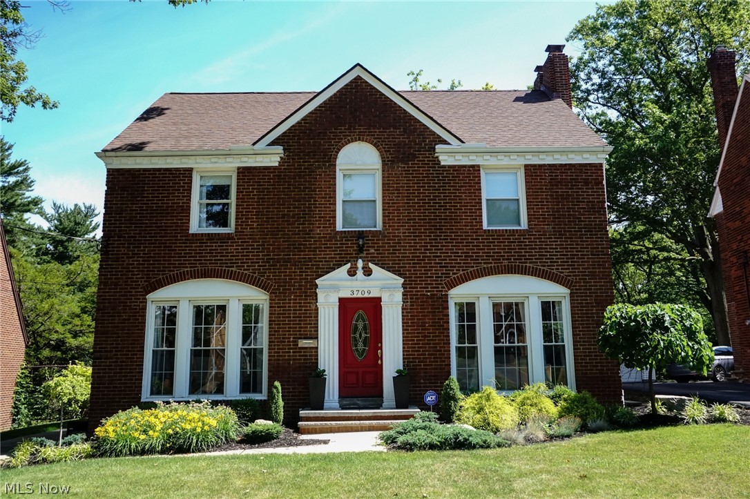 Welcome home to 3709 Washington. This beautiful brick colonial in University Heights features all of the charm from a traditonal colonial with updated modern touches. As you walk in the front door you are greeted by gorgeous original hardwood floors throughout and an abundance of natural light. Downstairs you will find a large living room with floor to ceiling windows and a working fireplace. As you make your way to the kitchen, pass through the formal dining room which also has floor to ceiling windows. The updated kitchen boasts granite countertops, stainless steel appliances and a breakfast bar. Off the kitchen is a half bath and access to the backporch. Upstairs are 3 spacious bedrooms with the master bedroom connected to the main full bath. Enjoy morning coffee on the upstairs balcony overlooking the large backyard. As you make your way up to the third floor there is a finished attic/4th bedroom with the second full bath-this space makes for a great guest room, office space, kids