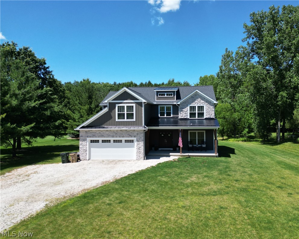 Looking for a newer home in Medina with acreage and modern finishes? Welcome to 4553 Sharon Copley Road, where nearly 3 private acres, quality construction, and exceptional care come together in a home that truly feels better than new.

Built by Nell Homes in 2022, this custom colonial offers just under 3,000 square feet with 5 bedrooms, 2.5 baths, an open floor plan, abundant natural light, luxury vinyl plank flooring throughout the main level and motorized blinds in living room and master bedroom.

The kitchen is designed for everyday living with granite countertops, solid hardwood soft-close cabinetry, Samsung Bespoke appliances, a large center island, and a walk-in pantry. The great room features a stone fireplace with a reclaimed barn beam mantel, while the first-floor flex room is ideal for a home office, playroom, or guest space.

Upstairs, every bedroom includes a walk-in closet, along with a loft, second-floor laundry, and a spacious owner's suite with a tiled shower and soaking tub. The full basement with 8-foot ceilings is ready to finish for additional living space.

Built with natural gas, a high-efficiency Carrier furnace, upgraded insulation, Cat6 wiring, and quality materials throughout, this home was designed for comfort and efficiency.

Since purchasing, the owners have professionally regraded the property and installed a beautiful new lawn, making this home as impressive outside as it is inside. Enjoy the maintenance-free deck overlooking the partially wooded backyard.

Country living meets convenience with Acme Fresh Market, Discount Drug Mart, restaurants, and everyday shopping just minutes away. Bonus - no HOA or city income taxes.