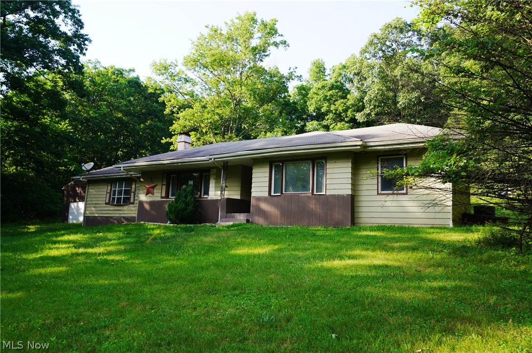 Location, location, location.  Beautiful private rural location on an acre. Near Salt Fork State Park.  With some TLC this three bedroom ranch on a full basement has great possibilities. Family room could be used as a fourth bedroom.  Privacy abounds, enjoy the sounds of nature on the back patio.  Small fenced in pasture is separated from the back yard.  There is both a detached garage and a two door pole barn for extra storage. HUD CASE #  413-775217