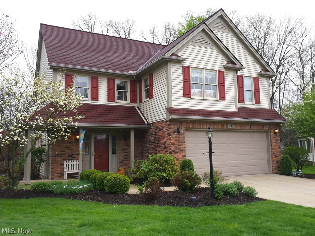 Dramatic cluster home overlooks 6th hole of golf course.  Updated glamour bath; Jack-n-Jill bath connects the other 2 bedrooms; loft and 2nd floor laundry room.  1st floor features stunning open floor plan with walls of windows, center island kitchen with granite counters and newer stainless appliances along with walk-in storage closet. Newer furnace, A/C, hot water tank, and roof. Recently repainted interior. Sliding doors lead to wrap-around deck overlooking park-like yard. Loads of storage including access to attic from pull-down stairs in hall.  All closets are divided with built-ins.
