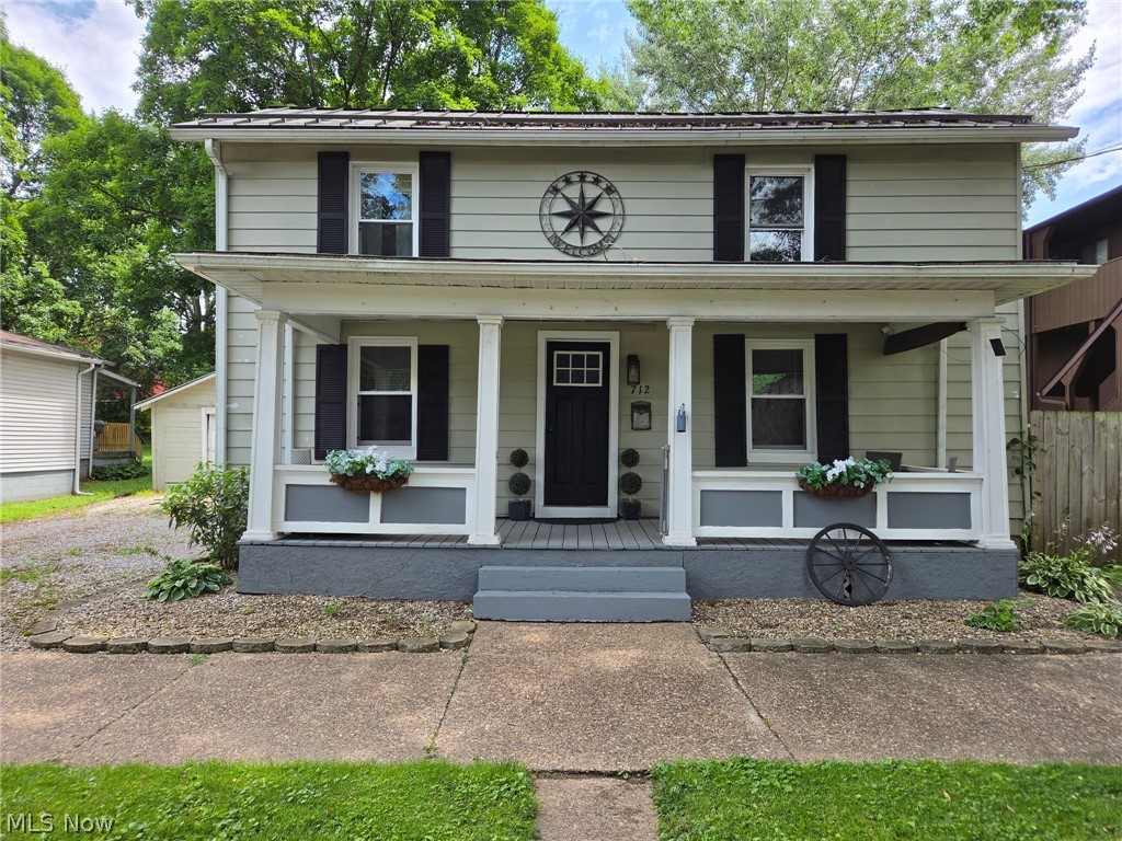 BACK ON MARKET DUE TO FINANCING ONLY! If you’ve been searching for a home with historic charm but want the major interior updates already completed, this 1890 beauty is ready to welcome you home. Step inside and you’ll immediately appreciate the character paired with thoughtful interior renovations. Laminate flooring flows throughout, creating a clean, cohesive feel. The fully remodeled kitchen is a standout feature, offering granite countertops, updated cabinetry, and a spacious walk-in pantry — ideal for both everyday living and entertaining. The main-floor bathroom has been completely renovated and smartly designed to include a convenient laundry combination. Upstairs, a second bathroom already has fixtures in place and simply awaits completion — providing a great opportunity to add additional value over time. A newly constructed staircase leads to the second level, where the primary bedroom showcases exposed ceiling beams for added warmth and architectural charm. You’ll also appreciate the abundant attic storage — a rare bonus in many older homes. Major improvements include a newer metal roof and replacement windows, offering peace of mind on key components. Situated on a double lot, the property provides an abundantly large backyard enclosed by a newer wood privacy fence — perfect for pets, play, gardening, or creating your own outdoor oasis. The oversized single-car garage offers off-street parking, and alley access allows convenient entry to the backyard. Covered front and back porches add inviting outdoor living spaces to enjoy morning coffee or evening relaxation. While most updates have been focused on the interior, the exterior offers an opportunity for cosmetic improvements, allowing a homeowner to build equity and truly make this property their own. A wonderful blend of historic charm, modernized interior spaces, and outdoor potential — ready for its next chapter.