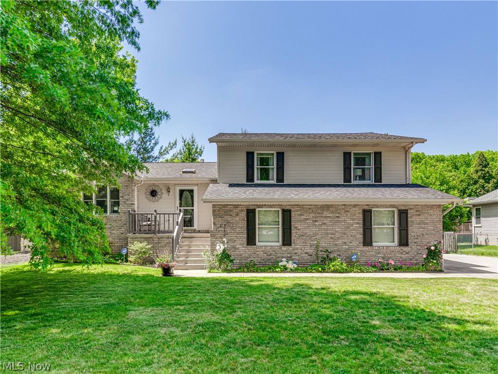 Nestled back in the peaceful Fairlawn Heights neighborhood this home is ready for you!
Enjoy being greeted at the front entry with a cozy porch for enjoying
your morning coffee. Step inside to a bright and open atmosphere
defined by vaulted ceilings and abundant windows that bathe the home in
natural light. This level includes a large, open living room that flows into a
formal dining room with a new chandelier, then opens into a beautiful, modern
kitchen with stunning backsplash and granite countertops. Newer stainless steel
appliances, plenty of recessed and under cabinet lighting, and a gathering table
to enjoy daily meals or entertaining family and friends. The dining room
sliding door leads to a beautiful deck to provide access to grilling and
enjoying company or relaxing on a beautiful day. Retreat upstairs to the primary suite featuring a walk in closet and modern bath
with double sinks, soaking tub, along with walk in shower. One additional
modern full bath is on the second level as well as two additional bright and
cozy bedrooms. The family room level offers a large entertainment area
complete with a beautiful gas fireplace and sliding glass doors leading to the
patio. This level also has a full, updated bathroom. Easy access to a large, 2-car attached garage for
convenience. The lower level compliments the house with a billiards
room and entertainment center. There is a separate workshop and laundry
area. The property also has a 12 x 8 double door shed for plenty of storage.
Key updates include a newer roof, furnace and air conditioner, hot water tank,
deck, swing set, extended concrete driveway and sidewalk to patio, beautiful
outdoor lighting providing ambiance and highlighting the home's warmth,
carpeting, and plenty more. This home offers
many amenities and you simply can not beat the Fairlawn Heights location!