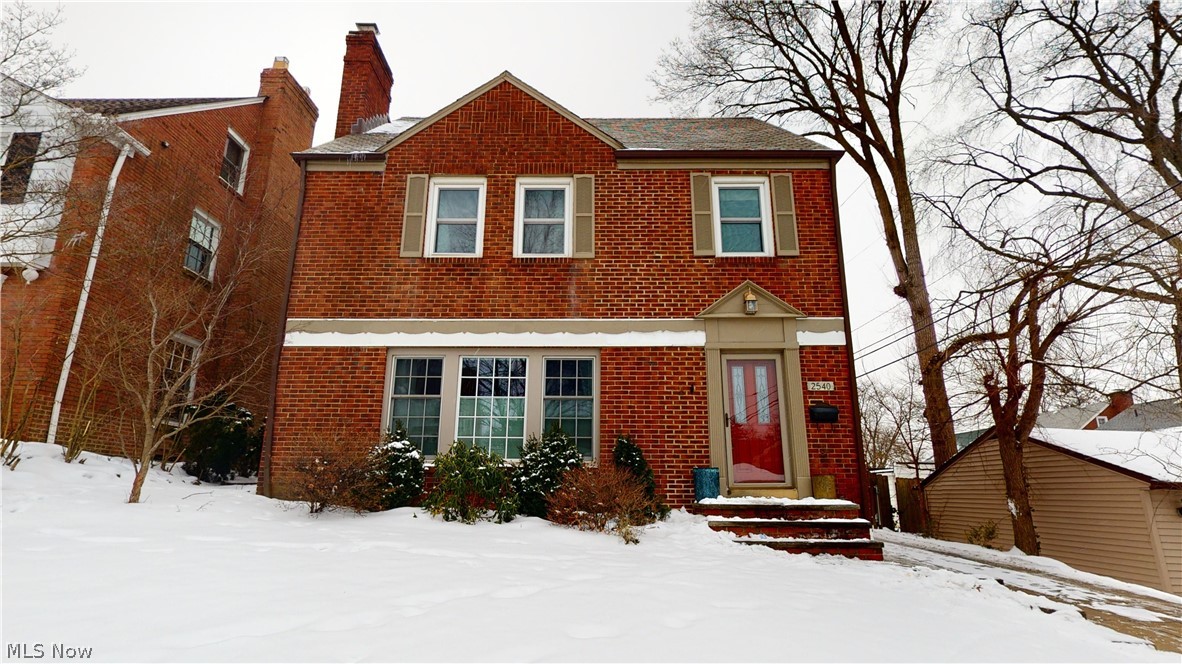 Beautiful brick colonial invites you to live with stylish old world charm with updated features. This home is full of character with a warm interior showcasing rich and inviting dark hardwood floors with architectural details throughout. Welcome your guests into the foyer and living room with a cozy fireplace. Step up to the formal dining room, perfect for both entertaining guests and family dinners. The dining room leads to a spacious office space overlooking the backyard and a beautiful deck The incredible kitchen features stainless steel appliances and an eat-in area. The generous master bedroom features hardwood floors and two spacious closets. The hall bathroom has double sinks, as well as a newer  (2017) customized Onyx shower and for those long days a Jacuzzi bathtub. Two more bedrooms round out the second level. An updated third level boasts a fabulous bonus room with built-ins opening up to a fourth bedroom. The lower level offers additional living space with newer flooring (2