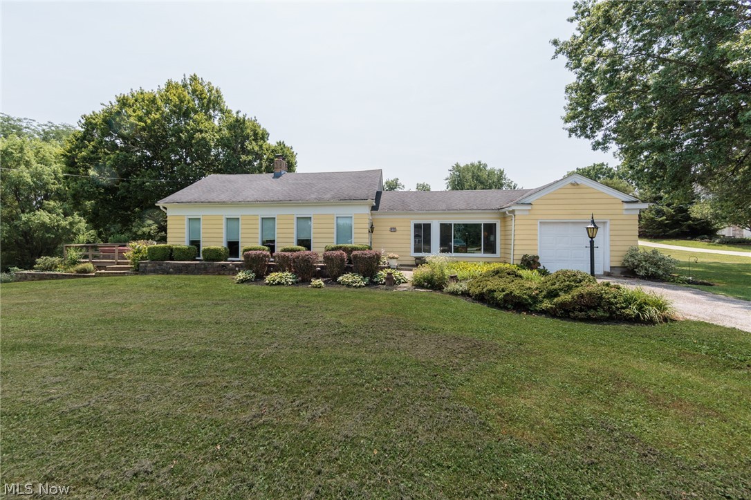 Adorable home in Granger Township and Highland Schools. You will love all the floor to ceiling windows and wood accents throughout this home including many built ins and extra storage. 3 bedrooms with one bedroom on the first floor. One acre of scenic property to enjoy in the country but a short drive to shopping and restaurants. Open floor plan takes advantage of the views with plenty of outdoor space. New electric cooktop stove. Front window replaced in kitchen. The basement has been waterproofed with transferable warranty. New furnace in Dec. 2024. New carpeting and glass block windows added in the basement. The basement has a large recreation area and storage room. Dual laundry set up one on first level and also in the basement. Garage is two car plus tandem. Available for quick occupancy.