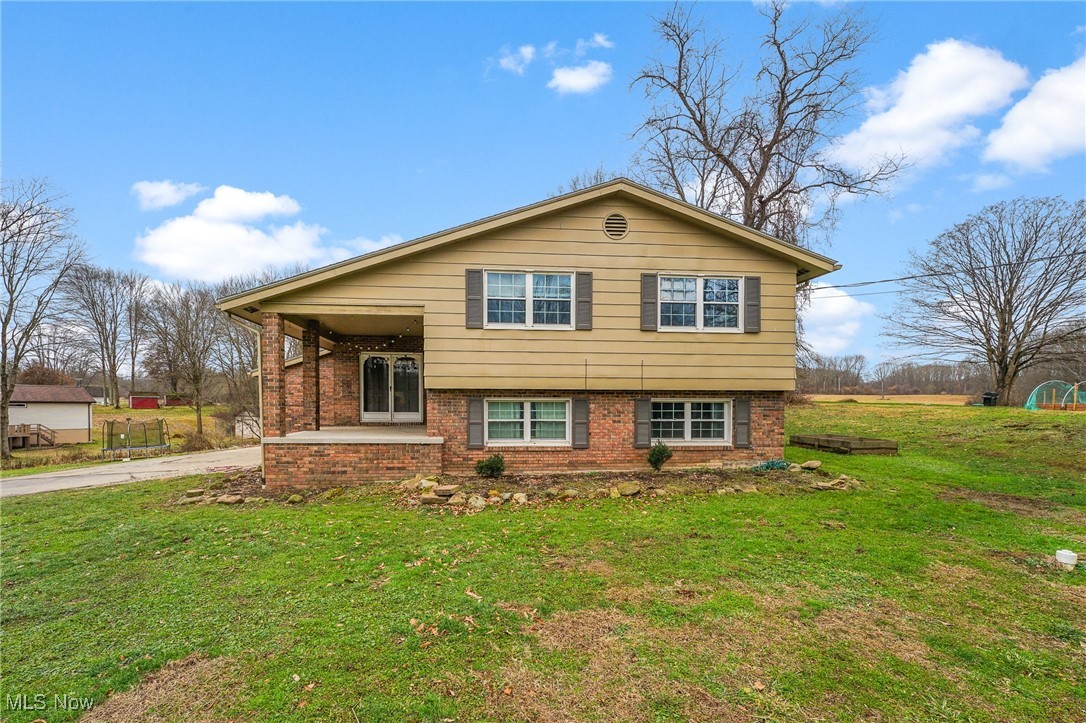 Welcome to 2974 Schotten Rd., a well-maintained bi-level home located in Hubbard Township within the Hubbard School District, offering space, functionality, and recent updates throughout. This property features a rare 4-car garage setup with two attached and two detached bays, perfect for vehicles, storage, or hobby space. The inviting front porch leads into a welcoming foyer that opens to a bright vaulted-ceiling living room with comfortable carpeting. The living area flows seamlessly into the dining space, creating an ideal layout for everyday living and entertaining. The kitchen, while a separate space, remains well connected and offers wood cabinetry, laminate countertops, stainless steel appliances, and a breakfast peninsula providing additional seating for an eat-in option. The upper level includes two generously sized bedrooms, both featuring newer carpet and double closets, along with a full bathroom complete with a stylish vanity, tub, and tiled walls. The lower level expands the living space with two additional bedrooms, also offering newer carpet and double closets, plus a second full bathroom featuring a tub surround and vinyl plank flooring. A dedicated laundry and storage area adds convenience and functionality. Major updates include a dimensional shingle roof (2020), vinyl windows (2015), and a new septic system (2025). Additional features include a 200-amp electrical panel, 80-gallon hot water tank, Kinetico water treatment system, and reverse osmosis for enhanced water quality. This property delivers a thoughtful layout, key mechanical upgrades, and ample garage space, all in a desirable location. A great opportunity to own a solid, move-in-ready home with room to grow. HOUSE APPRAISED FOR 282,000. BUYER WAS NOT ABLE TO OBTAIN FINANCING AFTER TRYING MANY DIFFERENT OPTIONS.