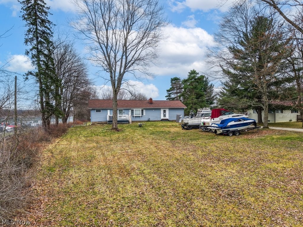 Fully renovated ranch on nearly 2 acres! This open-concept home features a beautifully updated kitchen that flows seamlessly into the dining area and out to a spacious walk-out deck—perfect for everyday living and entertaining. The main level offers three generously sized bedrooms and a fully renovated full bathroom. The attached 2-car garage has been converted into a large additional living space (completed just 2 years ago), creating the perfect bonus room for gatherings, a second living room, or flex space.

The fully finished basement adds even more value, complete with a large rec room, full kitchen, and an additional full bathroom—ideal for guests, entertaining, or potential in-law setup. Situated on almost 2 acres, this property offers privacy, space, and a large backyard deck to enjoy the outdoors. New Roof (2020)!  Garage renovation (2022)!  A/c and Furnance (10-12)!