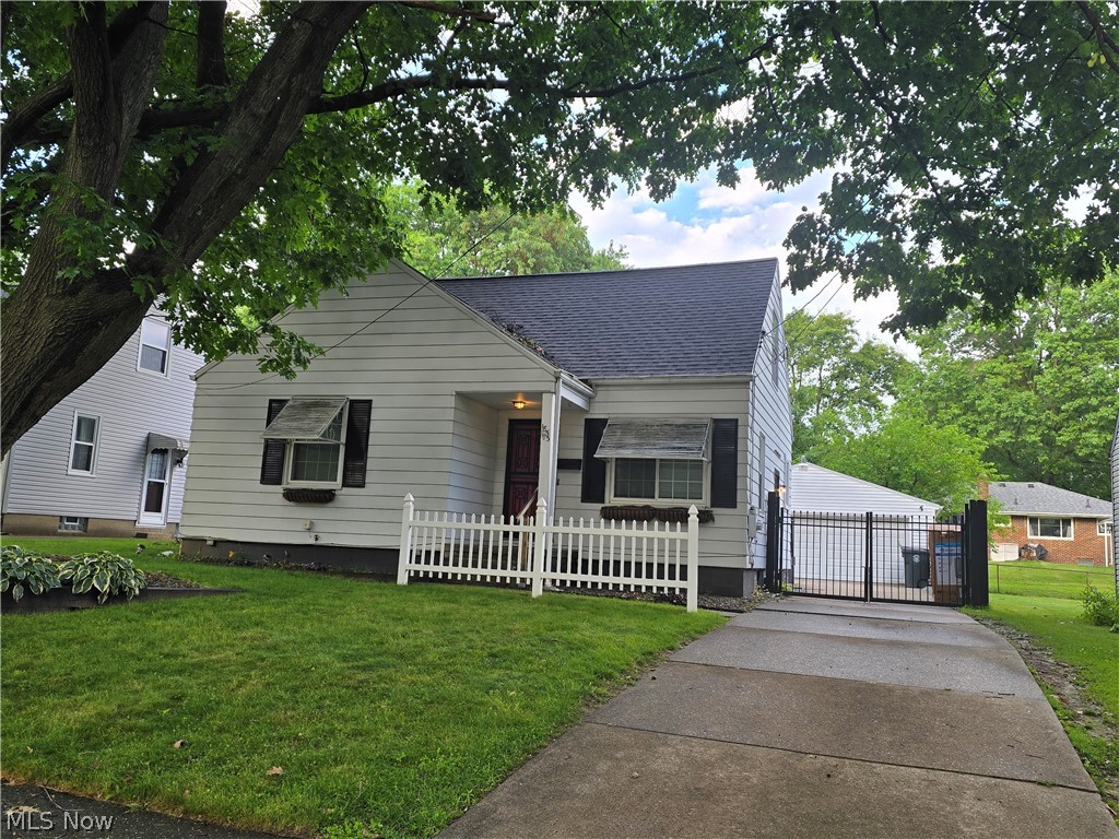 Welcome to this beautifully updated and exceptionally maintained Cape Cod in the heart of Firestone Park! This move-in-ready home offers 4 bedrooms, 2 baths, and an abundance of flexible living space designed to fit today's lifestyle. The main level features three spacious bedrooms which have beautiful hardwood under the carpet, a beautifully updated full bath with a stylish illuminated anti-fog mirror, and luxury vinyl plank flooring. Gorgeous original hardwood floors throughout the inviting living area filled with natural light. The updated eat-in kitchen is equipped with stainless steel appliances, a smart stove, and sliding glass doors that open to a stunning deck overlooking the fully fenced backyard with a firepit; creating the perfect setting for entertaining, family gatherings, or peaceful evenings outdoors. Upstairs, you'll find two finished rooms offering endless possibilities for a fourth and fifth bedrooms, home office, sitting room, playroom, or bonus space. The lower level provides even more living space with a family room, workshop, canning/storage room,  unfinished bathroom with shower, and a brand-new hot water tank. Additional upgrades include ceiling fans with remote controls throughout, an oversized 2½-car garage, a storage shed, and a wood privacy fence with a convenient rear gate leading directly to the garage. For added peace of mind, this home also includes an America's Preferred Home Warranty. Combining timeless charm with thoughtful modern updates, versatile living spaces, and exceptional value, this is a rare opportunity to own a truly turnkey home in one of Firestone Park's most desirable neighborhoods. Don't miss your chance to make this beautiful home yours! Schedule your private showing today! Monique Rankins 330-703-7019. More photos to come this evening.