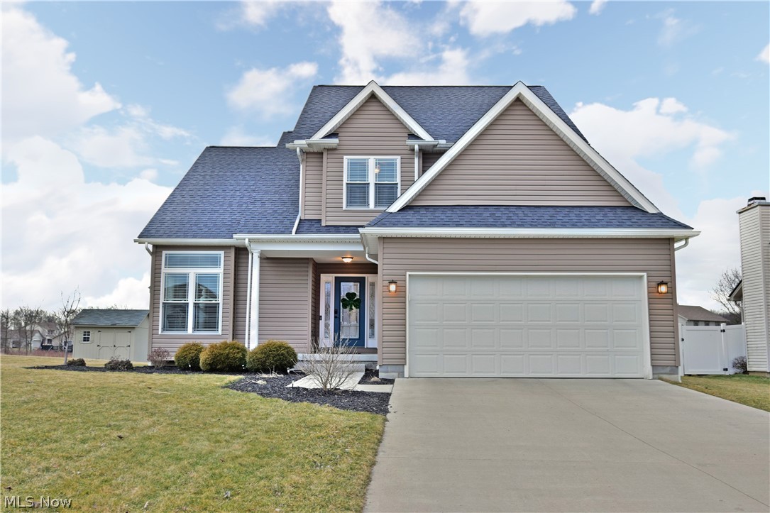 With absolutely-gorgeous interior appointments and a great, modern layout; this newer construction home is sure to move quickly! Two stunning living levels and a partially finished basement await in this move-in-ready home. Sat deep in a private development, this residence is surrounded by other high -quality homes to create a welcoming neighborhood setting. The handsome neutral exterior is accented in white trim work for a clean and tasteful appearance. Inside, the first floor welcomes you to an open layout with tall ceilings that follow the stylish staircase just past the foyer. Natural light pours in past the brick fireplace as recessed overhead lighting adds to the effect. Dark hardwood style flooring hides beneath as a large corner dining area doubles as a family room with barstool seating on the kitchen side. Perfect for relaxing or converting to additional casual dining. The high-quality stainless appliances compliment the look in this highly functional kitchen, boasting big tim