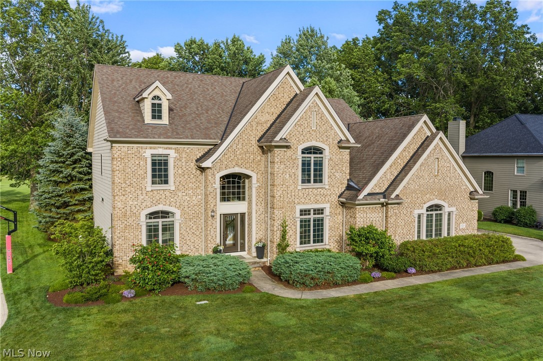 Stunning home in Avon Lake’s Legacy Pointe with golf course views. Grand two story foyer and living room with tall stone fireplace and massive wall of windows is open to the chef’s kitchen featuring stainless steel appliances, granite counters, light wood cabinets, large island and butlers pantry. Hardwood floors on much of the first floor, abundance of natural light and high ceilings. Gorgeous powder room with floral wallpaper, dedicated office with dual sided fireplace, first floor laundry, dining and sitting room complete the first floor. Luxurious primary suite has vaulted ceiling, soaker tub, large shower, dual vanity and massive walk-in closet. 3 additional, nicely sized bedrooms and 2 full bathrooms are on the second floor. The finished basement offers an additional 1500 sq feet(approx) of living space with stunning bar complete with sink, refrigerator, dishwasher and beverage refrigerator- the 5th bedroom has egress window. 3 car side load garage, sprinkler system, home generator, mature landscape, situated on the third hole of Legacy Golf Course. Community offers, pool, tennis and recreation. Avon Lake is known for excellent schools, parks and Lakeside enjoyment. Close to shopping, highways, restaurants and entertainment. This spectacular home has so much to offer, schedule your showing today!