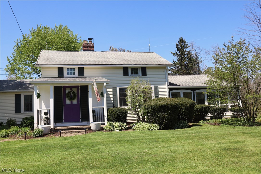 This classic North East Ohio equestrian facility offers a main barn with 28 stalls, feed-room, tack room/ office and indoor arena. There is an outdoor arena, a well-maintained century home with an attached garage, a carriage house apartment, a century barn with 8 stalls, and additional garage. A workshop, shed, and wishing well. The farm boasts both a stable entrance and private residence entrance that connect by a gated archway. The farm also offers actual turn-out, both in grass and all-weather footing surrounded by maintained board fencing. The layout of the property is conducive for functionality and ease of horse management, with designated manure storage. The century home is sheltered from the road by a privacy hedge and graced with tasteful landscaping. The home received extensive updates in 1991, creating a first-floor owners suite with attached study. The first floor offers a convenient layout with laundry, kitchen, open living and dining area and an additional full bath. Enjoy relaxing on the beautiful, enclosed porch; a morning room off the living room. The second story has three bedrooms (two are tandem). The carriage house apartment is well removed from the main residence, and offers a living room, laundry, kitchen, dining area, private courtyard and one bedroom and bathroom. There are so many wonderful parts to this property for the next steward to love and embrace.  Main barn roof was replaced and insulated in '25, the long walls on the arena were rebuilt in '23-'24, new doors on century barn in '22, new gutters w/ leaf guard on main house & carriage house in '25, the cupola was rebuilt in '22, main house received Andersen windows in '20, new pool heater in '25, main house furnace and A/C replaced in '25, hot water tanks in both the main house and carriage house were replaced in 2020.