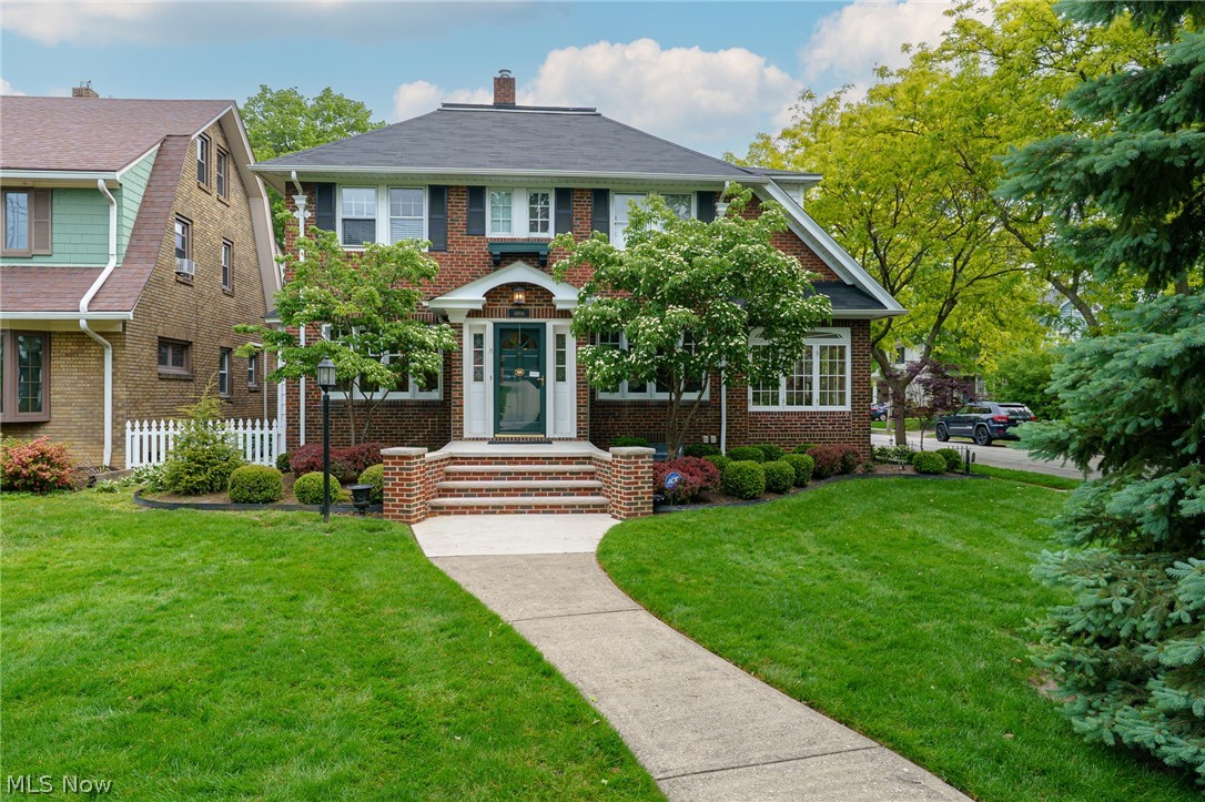 Stately brick home in a highly desirable Lakewood location, just moments from Lake Erie! Beautifully preserved and meticulously maintained, this impressive 5-bedroom, 3.5-bath residence with first floor family room and sun room combines timeless architectural character with thoughtful updates throughout. Step inside to discover beautiful natural woodwork, rich crown moldings and the craftsmanship and detail rarely found in newer homes. The spacious floor plan features an inviting eat-in kitchen, formal dining room and generously sized living spaces ideal for both everyday living and entertaining.

The finished lower level provides additional living and recreation space and features a fireplace, while the five bedrooms offer exceptional flexibility for family, guests or home offices. Outdoors, enjoy a beautifully designed brick-inlaid private patio, surrounded by a fully fenced yard and mature landscaping—an exceptional setting for outdoor dining and entertaining. Charming flower boxes and classic awnings further enhance the home's distinctive curb appeal.

Numerous improvements reflect the care given to this property, including an updated second-floor bath, kitchen improvements including cabinetry, backsplash and refrigerator, electrical improvements, garage improvements with leveled floors, cleaned drains, fresh paint and a newer garage door, and rebuilt front steps in 2025. The roof was replaced in 2011. A fully operational sprinkler system keeps the landscaping looking its best, while two separate central air-conditioning systems provide efficient comfort for the first and second floors.

Located near the lake and convenient to everything Lakewood has to offer, this is a pristine, meticulously maintained home with exceptional character, space and craftsmanship. A truly special Lakewood residence ready for its next owner.