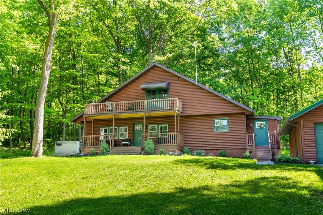 Welcome to this tastefully updated Cape Cod nestled in a beautiful wooded setting. Accessed by a shared driveway, the home is situated in a peaceful location overlooking a large stocked pond and surrounded by nature. A spacious outbuilding with electric provides excellent space for storage, hobbies, entertaining, or gatherings. Step inside to an inviting open-concept floor plan filled with natural light. The living room flows seamlessly into the dining area and kitchen, creating an ideal layout for everyday living and entertaining. The kitchen comes complete with appliances that will remain with the home. The main level features two generously sized bedrooms and a full bathroom conveniently located between them. Upstairs, the private primary suite offers a full bathroom and double doors leading to a covered deck overlooking the pond and wooded surroundings. With its extensive interior updates, scenic views, and peaceful setting, this property offers a unique opportunity to enjoy country living while still being within reach of everyday conveniences. Property has a brand new water treatment system. Schedule your private showing today to experience all this home has to offer.