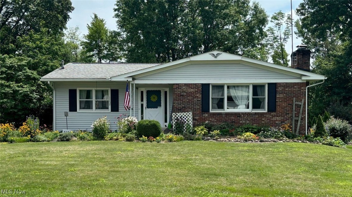 Do Not Miss This Well Maintained Home Surrounded by Gardens!!!  With 1,808 sq ft of finished main floor living space and an additional 700 sq ft of finished living space in the lower level, this spacious 4 bedroom 2.5 bath ranch can look deceiving! The fully applianced kitchen sits in the heart of the home and can be easily accessed from all gathering areas. The formal living room has a wood burning fireplace and connects seamlessly to a dining room.  The back hallway leads to three generously sized bedrooms, a full bath, AND a primary bedroom with an attached ensuite. The main level also offers an expansive family room which connects to an enclosed sunroom followed by a large deck. Downstairs in the lower level, you will find a rec room with a wood burning fireplace, a bar area, a half bath, and a laundry room.  Outside, the driveway provides extra space for parking and leads to the rear entry 2 car garage which is accessible from the lower level. Inside of the garage, you will find a doorway leading into the large workshop/storage room and a root cellar.  Updates include: Furnace (2022), Roof (2019), Vinyl Siding (2019), Gutter Guards  (2019), Deck (built 2018  and re-stained 2023), Brand New Garbage Disposal (July 2024.) One year home warranty being offered!  Call TODAY for your private showing!