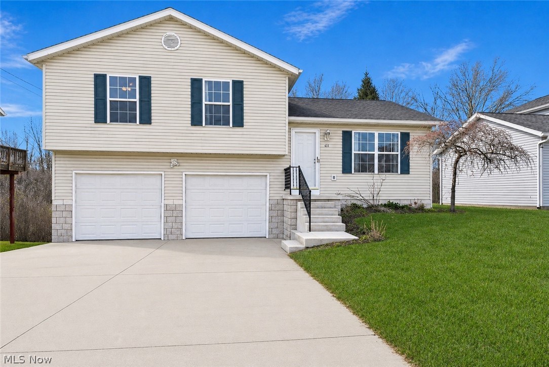 Welcome to this well-maintianed 3 bedroom, 1 full bath and 2 half bath home in Ravenna!  Upon entering the home you're greeted by an open, spacious layout.  The main level has vaulted ceilings and plenty of natural light highlighting a large living room, with new carpet, flowing seamlessly into the kitchen.  The eat-in kitchen has plenty of cabinets for storage and stainless steel appliances.  With sliding glass doors leading out to the back deck, the space is ideal for both entertaining and everyday living.  Upstairs are three well sized bedrooms, including a primary suite with its own half bath, walk-in closet and access to a full bath.  The lower level has another half bath, the laundry facilities and walk-out access to the backyard.  There is plenty of additional/storage space in the basement and ample parking space in a two-car garage.  With a great Ravenna location and plenty of recent updates, this home is move-in ready and awaiting it's next owner.  Schedule your private showing today!
