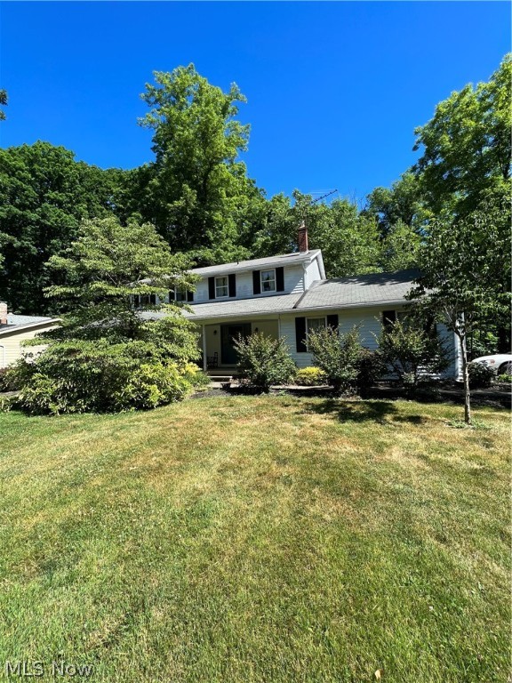 HUGE INVESTMENT OPPORTUNITY!! Large 4 bedroom colonial with TONS of potential. This home sits on nearly an acre lot which backs up the Mentor Marsh offering so much privacy. Large front porch to enjoy your mornings or evenings.  Large kitchen that leads to the family room with wood burning fireplace.  Enclosed porch to enjoy your beautiful wooded private backyard.  Full walk out basement. 2 car attached garage. What more could you want?! Schedule your showing today!!