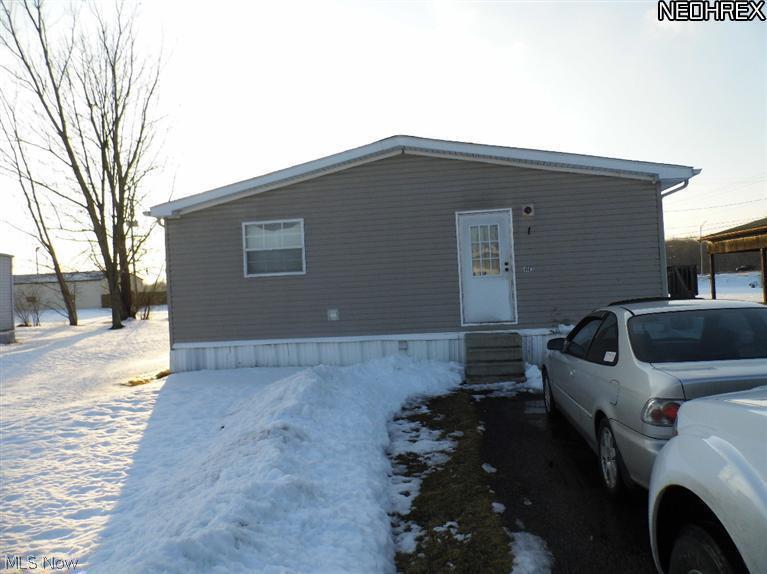 Awesome HUGE 2001 Pinnacle Double Wide Mobile/Manufactured Home on Leased Land. If Mobile home remains onsite, the lot lease is $276 per month. This is surprisingly huge at over 1,650 square feet of living space and is one of only a few that have NATURAL GAS, NO propane needed at this lot site! Gas and furnace are also gas! Public water & sewer with electric and gas. Master Bedroom Suite is HUGE! Nice large Master Bath with separate shower & toilet room, large tub and windows! Two additional bedrooms with closets, one nice size and one smaller with 2 full baths! HUGE Living Room, separate side entry from paved driveway, Front Door entry from deck and sliding glass door from Living Room! Has shed for outdoor stuff!Leased land Lot fee is $276 per month is stays on this location! This home was over $40,000 new! A couple of exterior TLC items but super nice unit! CHEAPER THAN RENT! Cash or loan, no rental and no lease purchase, sale only! Seller moving out of town. This is YOUR Opportunity