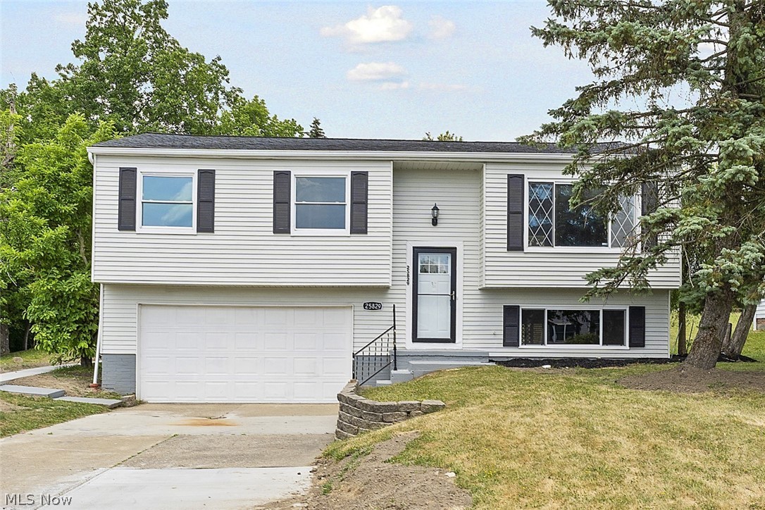 This gorgeous, fully renovated bi-level is the perfect place to call home sweet home! The lovely exterior is inviting and open and leads you into a stylishly modern interior! Step inside to the upper level main living area where a large living room, flooded with light from the front picture window, greets you! The open plan interior flows effortlessly into the formal dining area with chic chandelier and convenient breakfast bar leading to the kitchen. The fully updated kitchen is the perfect spot for cooking your favorite meals or hosting gatherings and features bright white cabinets, white subway tile backsplash, all stainless steel appliances and a double sliding glass door leading out on to the large rear deck. The deck overlooks the spacious backyard which offers room for your dream garden, family BBQs or a quiet spot to relax! The upper level has all 3 bedrooms and the full bathroom with large vanity and tile tub surround. Downstairs you'll find a roomy family or rec room, or perf