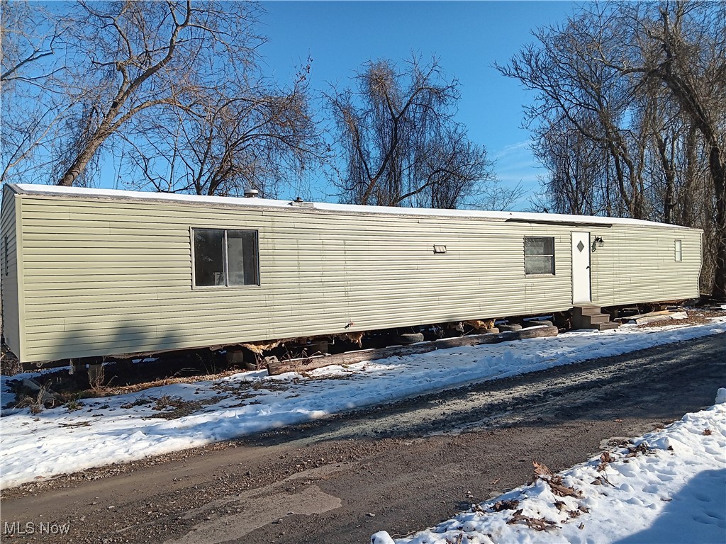 This 1985 14'x70' mobile home is awaiting it's new owner! With a little TLC this could be a great place to call home. Brand new siding, vinyl flooring throughout and new drywall has been installed! MUST BE MOVED from current location within 90 days of closing.