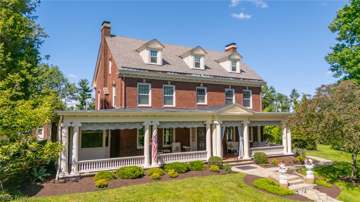 Step into a timeless masterpiece where elegance, craftsmanship, and historic charm come together. Built in 1926, this stately Colonial home offers 2½ floors of beautifully designed living space, showcasing the exceptional quality and attention to detail rarely found in today's construction.

From the moment you arrive, the home's commanding presence captivates with its classic Colonial architecture, magnificent front pillars, and an impressive 50-foot covered front porch—an inviting place to relax and enjoy peaceful mornings or evening sunsets.

Inside, soaring high ceilings, exquisite crown molding, and generously sized rooms create an atmosphere of refined sophistication. The grand living room and distinguished library each feature a beautiful fireplace, providing warm and inviting spaces for entertaining or quiet evenings at home.

Every corner of this remarkable residence reflects enduring craftsmanship and solid construction. Even the basement demonstrates the home's exceptional quality, with several rooms finished with durable tile walls and floors, offering endless possibilities for recreation, hobbies, storage, or workshop space.

Outdoors, the fenced backyard is designed for both relaxation and entertaining. A charming covered shelter and decorative pond, create the perfect setting for family gatherings, outdoor dining, or simply enjoying the tranquil surroundings.

Rich in character and architectural detail, this extraordinary home offers a rare opportunity to own a piece of history while enjoying spacious living and timeless elegance. Homes of this caliber and craftsmanship seldom become available—this is more than a house; it is a legacy waiting for its next chapter.