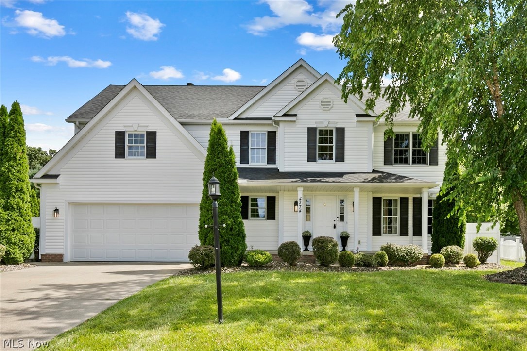 Welcome to 4374 Pletzer Boulevard, offering approximately 2,650 square feet of total finished living space, including 2,360 square feet above grade and an additional 290 square feet in the finished lower level. Located in one of Rootstown’s most sought after sidewalk lined neighborhoods, this well cared for home offers the space, setting, and updates buyers are looking for. Step inside to a dramatic 18 foot two story great room that creates an impressive first impression and a warm, open feel for everyday living and entertaining. The location is hard to beat with quick access to I-76 and an easy commute throughout Portage, Summit, and Mahoning Counties. NEOMED, BioMed, and the Rootstown School System are all just about 2 miles away, adding to the everyday convenience of this desirable setting. The kitchen features granite countertops and newer appliances, including a gas range in 2024, dishwasher and disposal in 2023, and refrigerator in 2022. The home has been thoughtfully refreshed with hardwood floors renewed in July 2026, new carpet on the main and second floors in July 2026 and newer carpet in the finished basement area in 2024. The half bath also includes a new cultured marble countertop and faucet, and all toilets were replaced in July 2026. Major updates include a new roof in 2021, Goodman furnace and A/C in 2024, and hot water tank in early 2023. The finished lower level includes a radon mitigation system, bonus room, and a unique wine tasting area. Additional updates include new front sconces and a new garage door opener in July 2026. Shed, swingset, kitchen appliances, and washer and dryer, new in March 2026, all convey. A spacious, updated home in a well cared for neighborhood with important improvements already completed and an excellent Rootstown location.