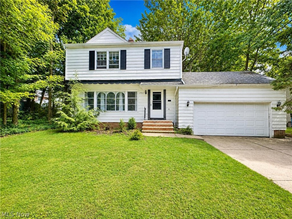 Welcome to 19631 Delaware Dr., a classic 3-bedroom, 1.5-bath colonial nestled in Euclid’s desirable Indian Hills community.
Perched on a hillside, this home offers an elevated setting with charming curb appeal and a 2-car attached garage. Inside, the spacious living room and formal dining room feature newer carpeting, creating comfortable spaces for everyday living and entertaining. The eat-in kitchen provides ample room for casual meals, while a convenient half bath is located just off the kitchen near the attached garage and basement access.
Step through the dining room door onto a wooden deck overlooking a private backyard framed by mature trees—an ideal spot for relaxing or enjoying the changing seasons. Upstairs you’ll find three bedrooms with gleaming hardwood floors and a vintage full bathroom showcasing its original yellow tile accented with black trim and the original tile floor, full of timeless character.
This solid home offers great bones and an opportunity to add your own updates and personal touches. Buyers to assume a short list of Euclid Point of Sale violations. A wonderful chance to create lasting value in a sought-after neighborhood. 2 parcels are included in this sale.  Near Indian Hills swim park and Euclid Creek Reservation.  Quick access to shopping and dining on Euclid Avenue and fast freeway access to I-90/Route 2.