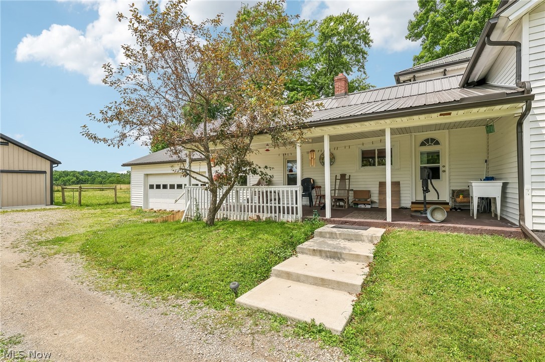 Discover timeless charm and modern updates in this beautifully maintained 4-bedroom, 2.5-bath Colonial in the heart of Middlefield. Built in 1860, this unique home offers 2,024 square feet of living space on a 0.54-acre lot. The updated kitchen features granite countertops, a new dishwasher, and new light fixtures. Enjoy relaxing in the fully enclosed front porch/sunroom or step onto the second-floor balcony overlooking the property. Major improvements include a new metal roof (2023), horse barn/stable (2023), and solar power system (2025). The impressive stable offers endless possibilities as a workshop, hobby barn, she shed, or collector car storage (no electricity). Convenient public water and sewer, a two-car garage, and a blend of historic character with thoughtful updates make this one-of-a-kind property a rare opportunity in Middlefield.