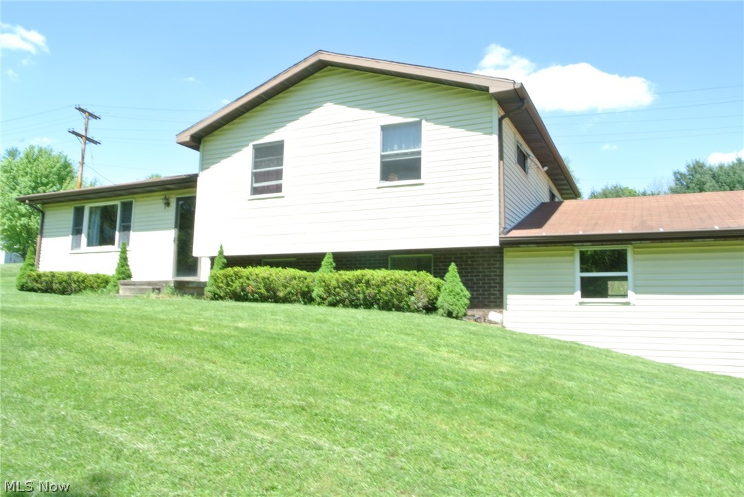 Immaculate home with a wood view. Spacious lot. New carpet installed May 2019. What a location - just minutes from the lakes and minutes to St. Clairsville. This home features a large rec room, new carpet throughout. Basement is plumbed for a second bath. Wood burner is connected to central heating system. Small town life; big town conveniences. Don't let this one slip away!