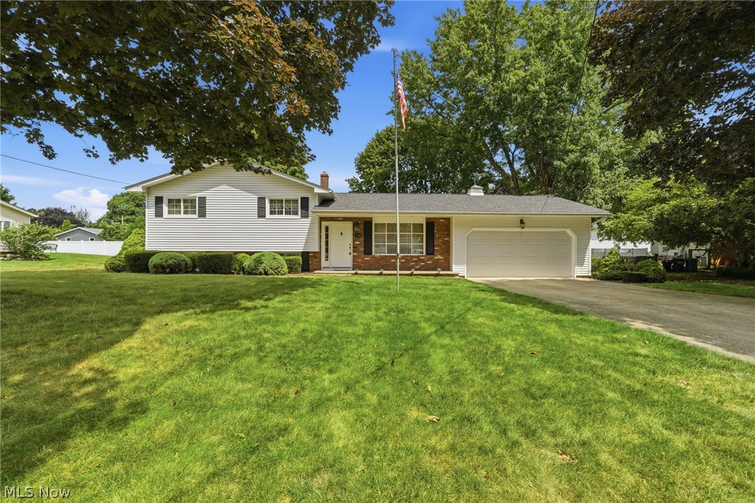 Welcome to this incredibly maintained 3-bedroom, 1.5-bath split-level, situated on approximately one-third of an acre. From the moment you arrive, it’s easy to see the care that has gone into this home over the years. Inside, you’ll find a comfortable, inviting layout, a spacious full bathroom with a double vanity, and dual closets in the primary bedroom. The lower-level recreation room features a cozy brick fireplace and plenty of space to relax or entertain. Outside, enjoy the backyard patio and built-in natural gas grill. Additional highlights include a heated garage with Nature Stone flooring, a five-year-old boiler, and a roof installed in 2025. Conveniently located near parks with easy access to I-90, this well-loved home is ready for its next chapter. This Home has the charm and character your looking for!