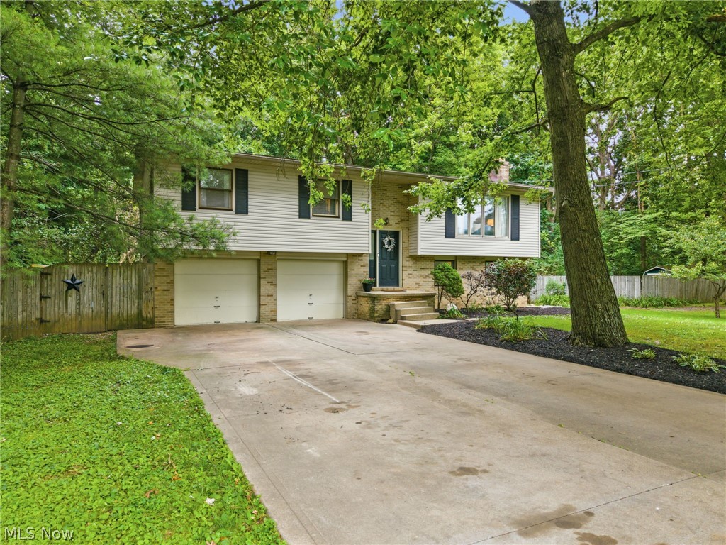 Welcome home to your own private retreat! This beautiful 4-bedroom, 2-bath home is nestled on 1.75 acres of wooded paradise, offering the perfect balance of privacy and convenience. Located in the highly desirable North Canton City School District, this property features a spacious, secluded lot surrounded by mature trees, creating a peaceful setting you'll love coming home to. Step outside and enjoy your own backyard oasis with a heated 22,000-gallon on-ground pool and a custom-built two-level deck, perfect for relaxing, entertaining, or making lasting summer memories with family and friends. Whether you're looking for a quiet escape or a home designed for outdoor living, this property has it all. Don't miss the opportunity to own this one-of-a-kind wooded retreat with all the comforts of home.