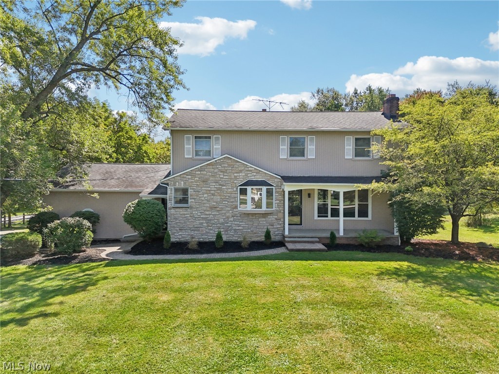 Step into modern elegance with this completely remodeled colonial. From the moment you enter, you’re greeted by a spacious living room that flows seamlessly into a stunning eat-in kitchen featuring Samsung stainless steel appliances, quartz countertops, sleek ceramic backsplash, and stylish lighting. Durable stone-core plank flooring runs throughout, tying together every detail. The main floor offers a spacious great room with sliders to brand-new composite decking, a versatile bedroom, and two fully remodeled powder rooms. Step outside to your backyard oasis, complete with a pool-ready yard and a three-season porch with its own powder room and built-in food prep station—perfect for entertaining. Please note - the pool needs both wall and liner renovation to make it functional. Upstairs, retreat to your owner’s suite with a walk-in closet featuring a custom organization system and a luxurious ensuite bath with heated floors and private balcony overlooking the pool yard. Three additional bedrooms and an updated hall bath complete the second floor. The partially finished basement is designed for relaxation and fun, boasting a fireplace, spacious bar, and beverage refrigerator—ideal for hosting friends and family. Nestled on a private corner lot, this move-in-ready home offers both style and comfort. All that’s left is for you to make it yours.
