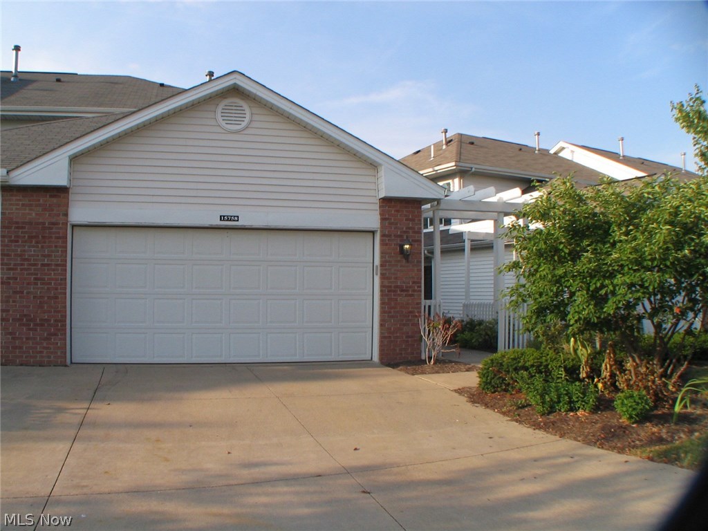 Welcome to 15758 Foxglove Lane. Enjoy maintenance-free living at its finest! This newly remodeled end unit townhome is super clean and move-in ready! Updates in the last four years include new flooring (tile, laminate, and carpeting), new maple kitchen cabinets, granite countertops, glass tile back-splash, stainless appliances (refrigerator, five-burner gas range, dishwasher, and microwave), double stainless sink and faucet, garbage disposal, cabinet hardware and lighting.  Additional updates include lighting, closet organizers, and plantation blinds. This townhome features a rare two-car garage which has been finished inside with wainscoting, freshly painted walls and floor, and the addition of pull down stairs for attic storage. The main floor features an open layout with oversized sliding doors to the north-facing rear deck-perfect for entertaining! A half-bath, laundry closet (washer & dryer stay), and a large pantry complete the main floor.  Generous storage throughout! Crystal La