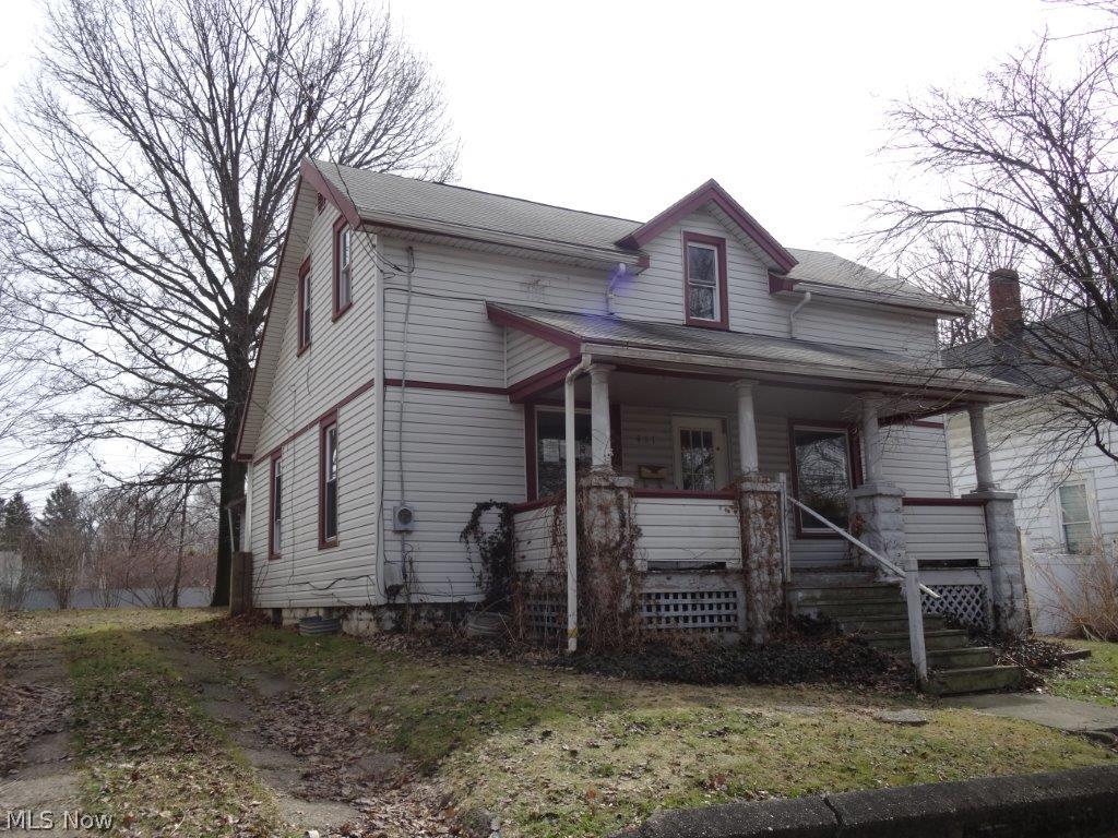Great price close to downtown Ravenna - great potential, will not last at this price!  2 car +  car garages, needs TLC.