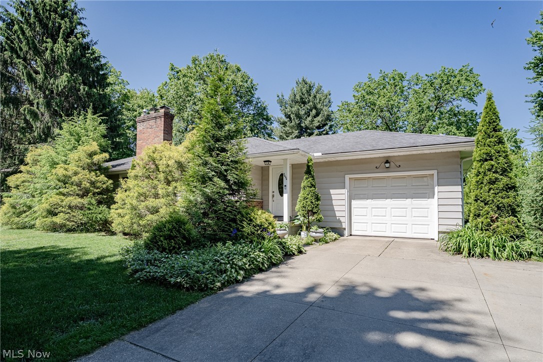 Welcome to 3496 Marcella Drive in Stow – Nestled behind a row of mature trees and surrounded by established landscaping, this well-maintained ranch offers privacy, comfort, and timeless appeal in a desirable Stow location.  Step through the front door into a welcoming foyer that opens to a spacious living room filled with natural light. A beautiful fireplace serves as the focal point of the space, while a huge picture window with sliders brings the outdoors in. Hardwood flooring flows throughout the living room and into the adjacent formal dining room. The thoughtfully updated kitchen features stainless steel appliances, updated cabinetry, and a cozy eat-in area perfect for morning coffee. Three comfortable bedrooms, each offering hardwood flooring and abundant natural light, provide inviting retreats for family members and guests alike. A charming full bathroom completes the main level. The full basement significantly expands the living space with two finished recreation rooms, a full bathroom, laundry area, and plenty of storage. Glass block windows provide added security and efficiency. Outside, enjoy relaxing on the spacious 20' x 16' deck with a shade sail overlooking the large backyard, creating the perfect setting for summer barbecues, outdoor activities, or quiet evenings at home. A 10' x 12' storage shed provides additional space for tools and equipment, while the concrete driveway offers parking for two vehicles. Recent updates include a roof and gutters that are less than five years old. Conveniently located just minutes from shopping, dining, and everyday amenities, this home combines comfort with accessibility. An attached one-car garage adds convenience and additional storage. Lovingly cared for and full of warmth and character, this wonderful ranch combines comfortable living spaces, functional updates, and a private setting to create a place you'll be excited to call home. Don't miss this opportunity to make 3496 Marcella Drive your next chapter!