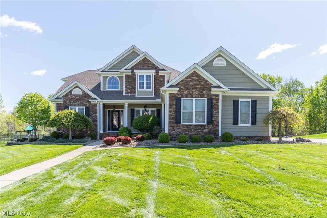 Beautifully maintained 4-bedroom, 3.5-bath home located in desirable Poland, Ohio! This exceptional property offers an open-concept layout perfect for everyday living and entertaining. The spacious eat-in kitchen features granite countertops, tile flooring, and newer appliances installed in 2023.

Attention to detail is evident from the moment you enter, with elegant crown molding, hardwood flooring, and thoughtful upgrades that add warmth and character throughout the home.

Enjoy the professionally landscaped yard, gorgeous stamped concrete patio, and fully fenced 6-foot backyard offering privacy and plenty of space for outdoor gatherings. Additional highlights include a whole-house generator, and a 7-camera security system for added comfort and peace of mind.

The finished walk-out basement leads directly into the garage and features a one-of-a-kind golf simulator setup that stays with the home, including the screen, mat, and monitor—perfect for year-round entertainment!

A pre-inspection has already been completed for added buyer confidence and a smoother transaction process.

Conveniently located close to shopping, restaurants, and beautiful Mill Creek Park, this home also offers easy access to both Pittsburgh and Cleveland, each approximately one hour away.

This move-in-ready home combines comfort, functionality, and unique amenities in a fantastic location. Don’t miss this incredible opportunity!