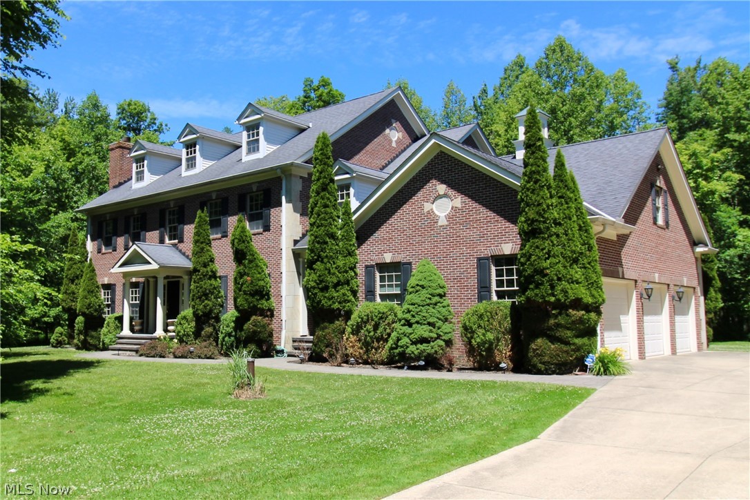 Walk into this fully custom Georgian style home nestled on a very private 3 acre wooded lot on a peaceful cul-de-sac street! Every room in this home has been freshly painted, genuine hardwood floors have been refinished, and plush brand new carpet has been installed throughout. Enjoy the serene private views of this property with your morning coffee on the gorgeous back porch with stained roof overhead or in the fully windowed eating nook off of the kitchen. This home boasts a grand staircase upon entry and is accompanied by stunning tall vaulted ceilings in the entry and grand primary suite. No expense was spared in this home with its thoughtful design, custom woodwork throughout, intricate crown molding, wet bar in dining room, dumbwaiter, and more! This home hosts 4 generous size bedrooms, two of which share a Jack and Jill bathroom, another with its own private entrance to another full bathroom, and the primary with a grand ensuite, an additional seating area, full cedar walk-in closet, and over 700 sq/ft of unfinished bonus space. The first floor den offers access to a full bathroom, and both the living room and family room each offer a cozy fireplace. Have the best of both worlds with this home offering peace and quiet nestled in nature while still in a cul-de-sac neighborhood!