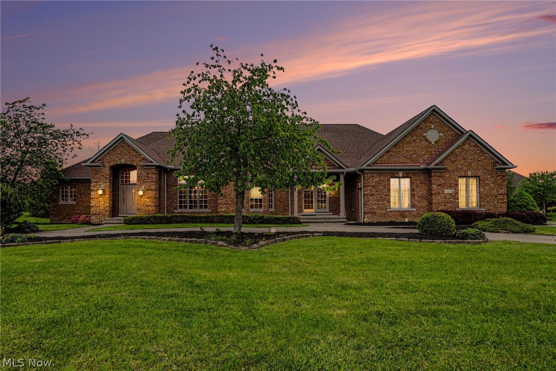 Highland Heights — A sprawling brick estate in prestigious Maypine Farm Estates, designed for luxury living and ideal as a multi-generational residence. Freshly painted and custom-built by M. W. Miozzi Homes, this residence offers approximately 4,500 sq ft above grade and over 7,500 sq ft total, showcasing exceptional craftsmanship throughout. The main level features a primary suite with a spa-like bath, along with a private in-law or guest suite complete with its own entrance, living area, bedroom, and full bath. Upstairs includes two spacious bedrooms with a Jack-and-Jill bath and a walk-in attic for ample storage. A grand foyer opens to a formal dining room with pillars, while the gourmet kitchen—featuring a large granite island, built-in appliances, and pot filler—flows into the great room with a fireplace and a bright sunroom leading to a two-tiered deck. Cherry hardwood floors run throughout. The expansive lower level offers two entrances, a family room, flex/exercise space, playroom, two full baths, and a second full kitchen. Additional features include five-Zone heating and cooling, whole-house surround sound, intercom, and security system. Exterior highlights include a circular driveway, two additional driveways, a four-car garage, and a full sprinkler system. A rare blend of elegance, space, and functionality. Award winning Mayfield Schools, minutes from I-90 and 1-271 Freeways and 20 minutes from Downtown Cleveland. This home truly has it all!