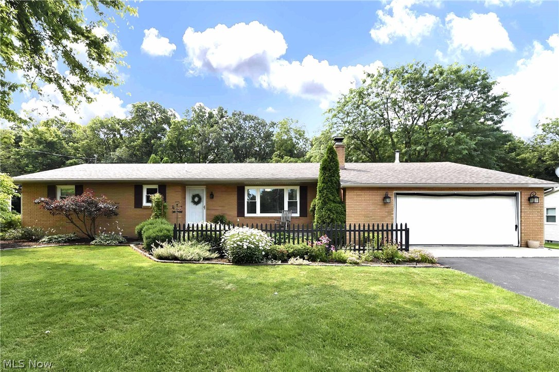 Fantastic Catawba ranch on a huge lot! This meticulously maintained home offers 3 beds, 2 baths, updates throughout & sits on almost 1/2 an acre. Step in to an open flow layout with beautiful laminate wood flooring, main living area featuring white washed brick fireplace, updated kitchen with eat-in area & brushed nickel appliances, 3 spacious bedrooms, 2 full baths with updated cabinets & flooring, dedicated laundry & attached 2 car garage. Walk out the back slider to a relaxation and/or entertainment haven! A concrete patio spans the rear of the home with grilling area, plenty of space for seating & attached pergola. 2 sheds sit on the property for additional storage. New AC unit (2019), vinyl windows (2021), and patio door with built-in blinds (2019).