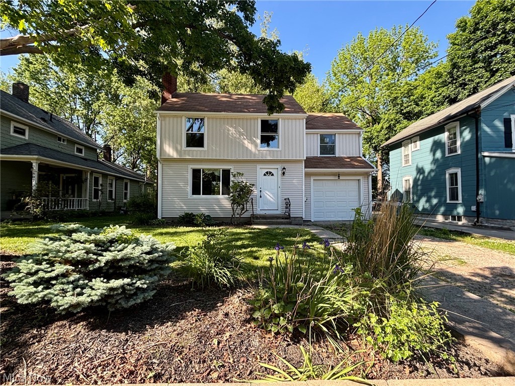 Welcome to this beautifully updated 3-bedroom, 2-full-bath home in the desirable Kent City School District! Conveniently located near downtown Kent and Kent State University, this home offers a blend of modern updates and timeless character.

The main level features a welcoming living room with a fireplace, a formal dining room with original built-in cabinets, and a completely renovated kitchen with new cabinetry, granite countertops, and a full stainless steel appliance suite including a dishwasher. Refinished original wood floors and charming woodwork preserve the character of the home while blending seamlessly with the modern updates.

Upstairs, you’ll find three generously sized bedrooms and a full bathroom, offering comfortable and functional living space. The finished basement expands the home with a spacious recreation room featuring durable LVP flooring, a second full bathroom, and laundry area.

Exterior improvements include new board and batten siding, gutters, garage door, front door, and the majority of windows replaced for improved efficiency and curb appeal. The newer roof provides added peace of mind for the next owner. An attached 1-car garage completes the property.

With thoughtful updates, preserved original character, and a convenient location close to shopping, dining, parks, and campus amenities, this move-in ready home is ready for its next chapter. Schedule your private showing today!