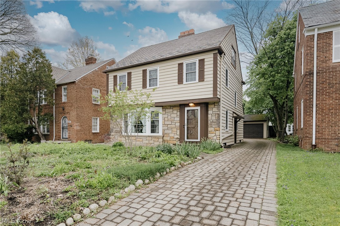Welcome to 3675 Avalon Rd in Shaker Heights, a charming colonial in the desirable Lomond neighborhood. The home showcases quality updates and refined finishes throughout. The front door opens into a welcoming foyer that flows into a spacious living room. This inviting space features a fireplace, recessed lighting, and a bay window. Wood flooring continues into the formal dining room, creating a seamless transition. The dining room connects to a well-appointed kitchen designed for both style and function. Highlights include high-quality cabinetry, a tile backsplash, a copper sink, and a full suite of appliances. A pantry area with a pressed tin ceiling adds character. A convenient half bath completes the main level. Upstairs, the second floor offers three bedrooms, all with hardwood flooring. A full bathroom features a tile shower surround and an updated vanity. The finished third floor provides additional living space. It includes a fourth bedroom and an ensuite full bath, offering privacy and flexibility. The full basement includes a finished recreation room with LVP flooring and built-ins. A laundry and utility area provides additional storage. An enclosed back porch off the dining room extends the living space. Outside, a paver driveway leads to a patio area, creating a welcoming space for outdoor enjoyment. This home combines classic character, thoughtful updates, and a flexible layout in a sought-after Shaker Heights location.
