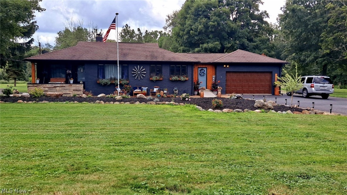 A must see 3 bedroom ranch with 2 full baths on almost 2.5 acres in highly desired Highland School District! Beautiful hardwood floors run though the updated, chic family room, dining room & 2 bedrooms. Updated main level bath with huge glass block window is situated between both bedrooms. Fully equipped kitchen provides beautiful oak cabinets with convenient pull-out shelving, stainless steel appliances, & gorgeous picturesque windows. Huge picture windows are found throughout the entire main level. The completely renovated, heated breezeway leads out into the 2 car garage. The lower level has been completely renovated & converted into a walk-out, which consists of a huge bedroom with woodburning fireplace, rec room, remodeled, handicap accessible bathroom, chair lift, large laundry/bonus area, & exterior elevator/lift. The massive 48x34 outbuilding with metal roof is a mechanics dream, offering electric, hot/cold water, heat, oil change bay, & 12’ door. The endless possibilities continue outside where you will find new hardscaping throughout, a fully stocked pond, 3 tier deck with pool, hot tub, gazebo, paver patio with custom fire pit, & hardy furnace. A detailed updates list is available upon request.