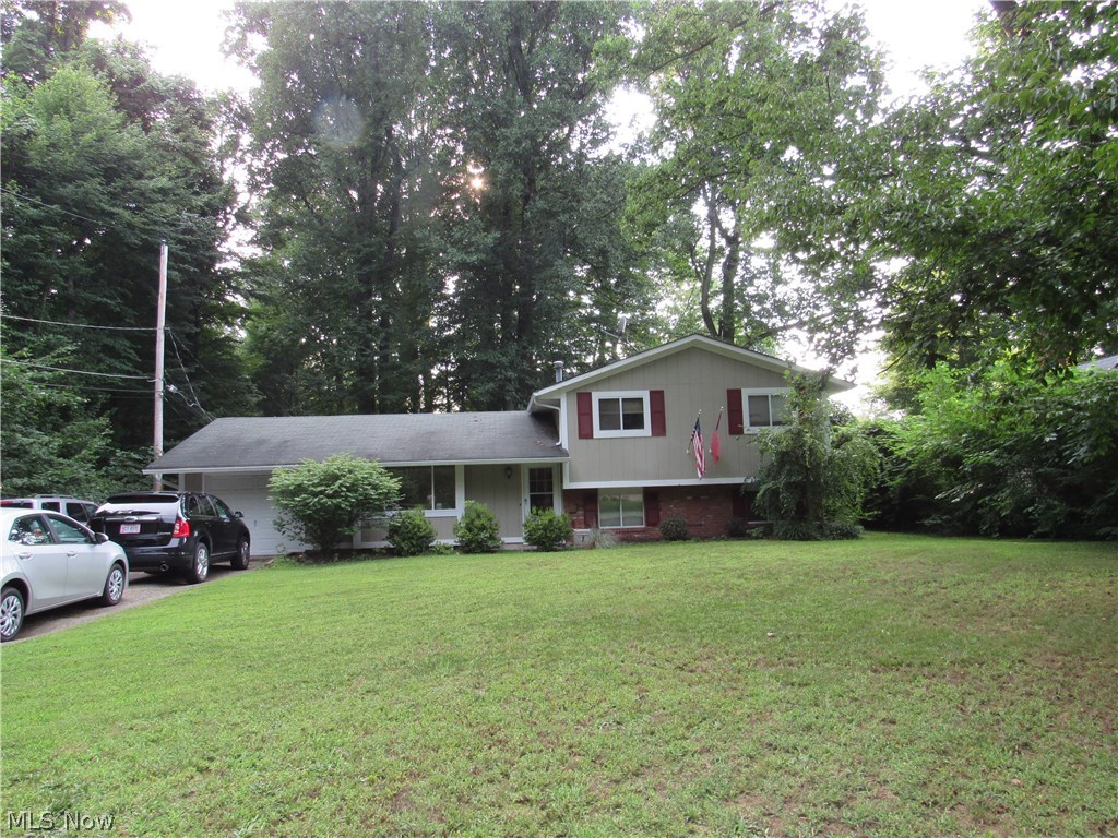 Do you prefer privacy?  Then you've found your private place.  As you face this lovely split level home, note the dense wooded area to your left, with a little pathway at the street leading you to walk among nature enjoying your quiet time.  The woods continue alongside the entire rear yard.  The open floor plan will amaze you when you walk through the front door to the spacious living room and dining room.  The kitchen slider leads you to the rear patio ready for entertaining and then you can make your s'mores at the fire pit.  The bathrooms and kitchen have been updated for your comfort.  If you are looking for day care...it's just down the road not even 5 minutes away, along with department store shopping, grocery stores, fast food restaurants in addition to restaurant/bar casual dining.  All of this at your fingertips!!  Why not call this property your HOME NOW??